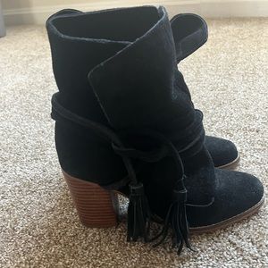 Cute black booties with strings that wrap around with tassels at the end